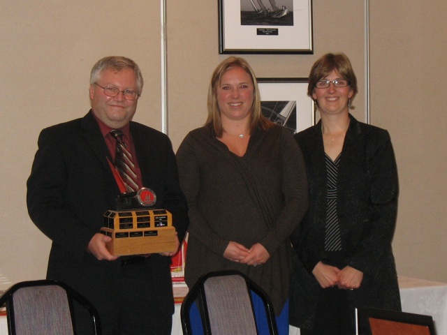 Photo: Steve Accepts the Vulcan Fireproof Trophy from Shelley and Marika