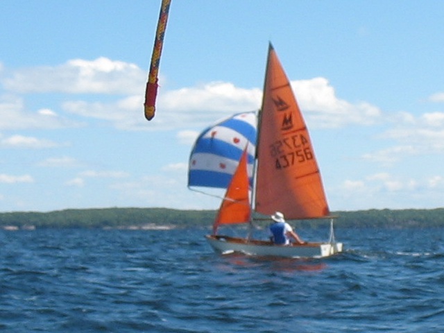 Photo: Aleid Flies His Spinnaker Towards the Hole in the Wall